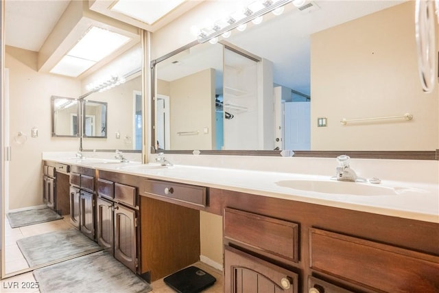 bathroom with vanity and tile patterned floors