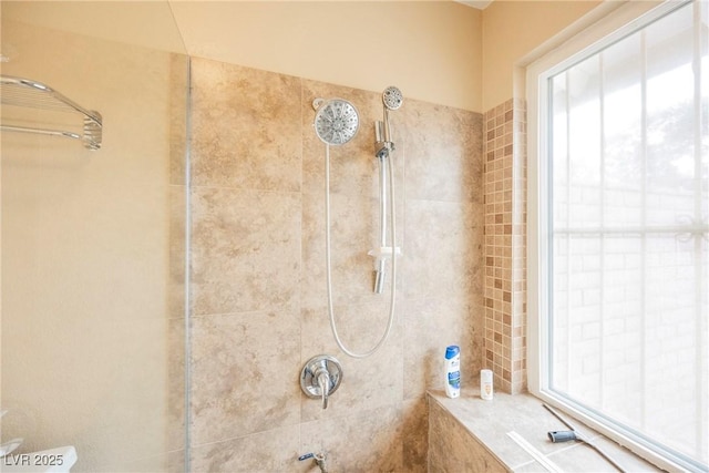 bathroom with tiled shower