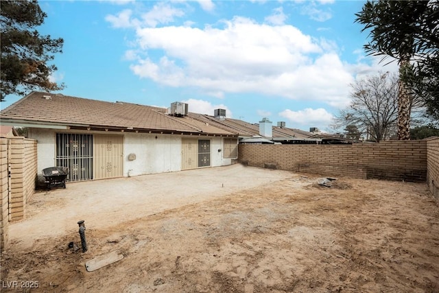 back of property with cooling unit