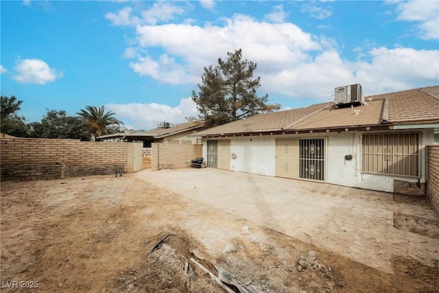 back of property featuring a patio area and central air condition unit