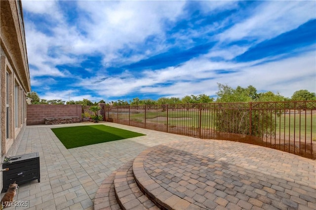 view of patio with a fenced backyard