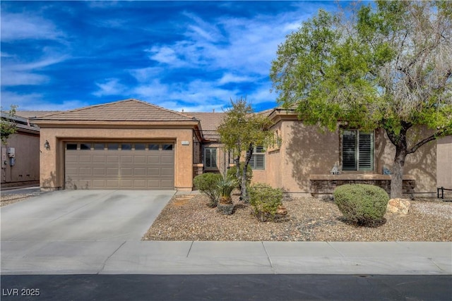 single story home with driveway, stucco siding, a garage, and a tiled roof