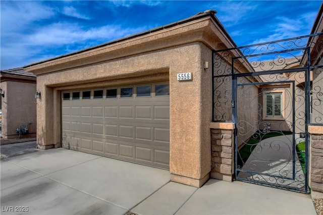 garage with concrete driveway