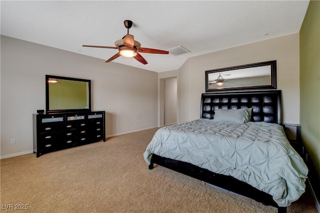 bedroom with baseboards, a ceiling fan, visible vents, and light colored carpet