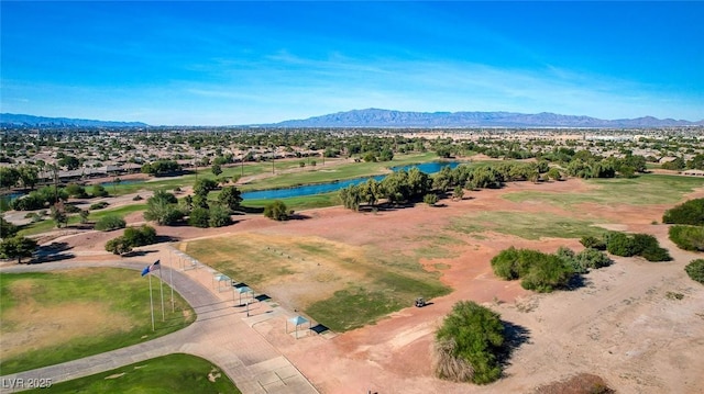 drone / aerial view featuring a water and mountain view