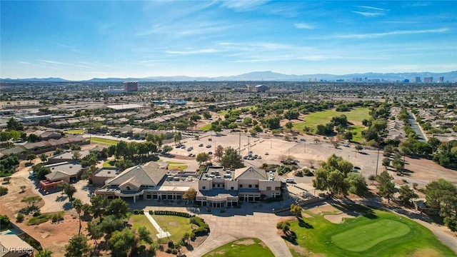 aerial view with a city view, a mountain view, and golf course view