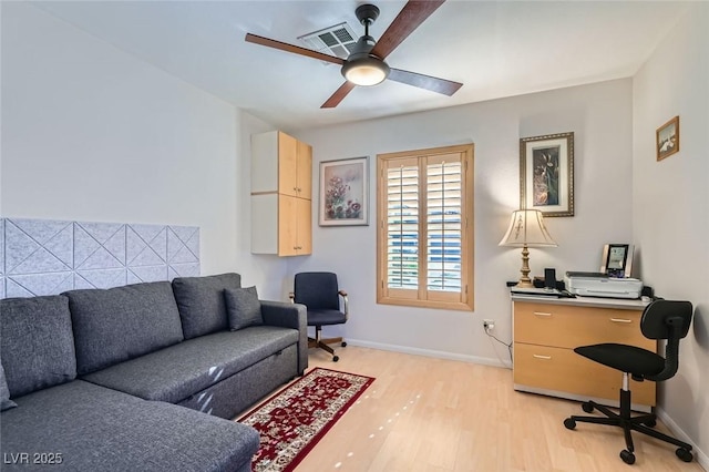 office space with light hardwood / wood-style flooring and ceiling fan