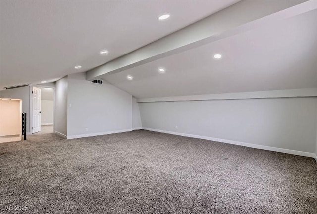 bonus room featuring carpet and vaulted ceiling with beams