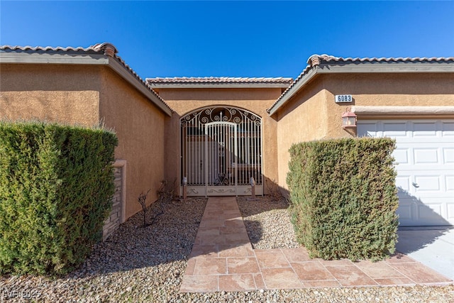 entrance to property featuring a garage