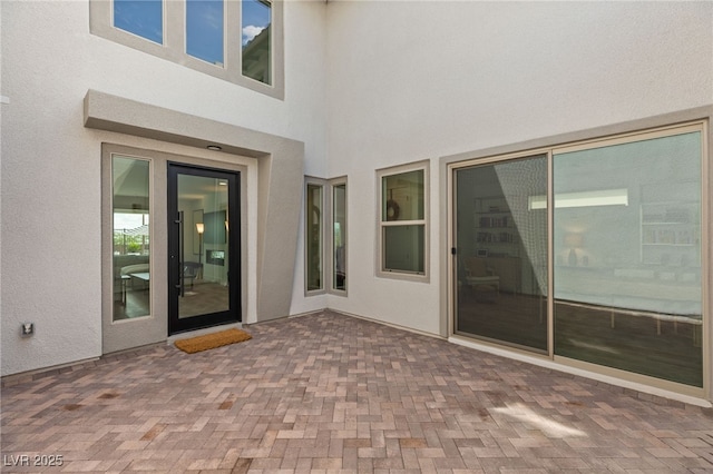 exterior space featuring a patio and stucco siding