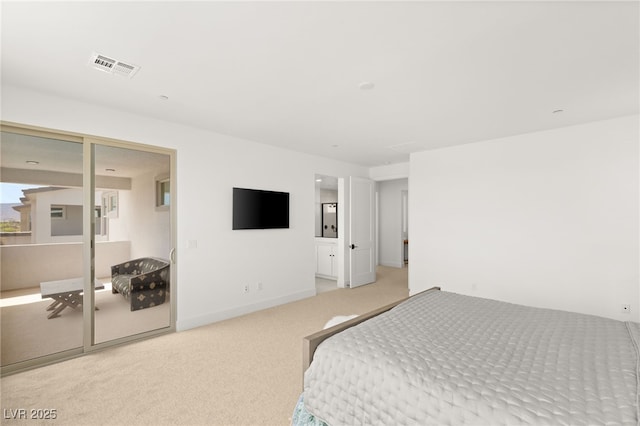 bedroom featuring light colored carpet