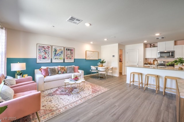 living room featuring light hardwood / wood-style flooring