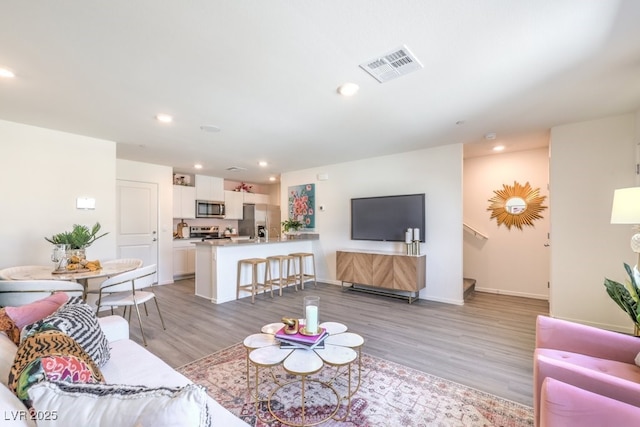 living room with hardwood / wood-style floors