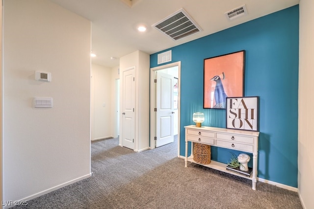 hallway featuring carpet flooring