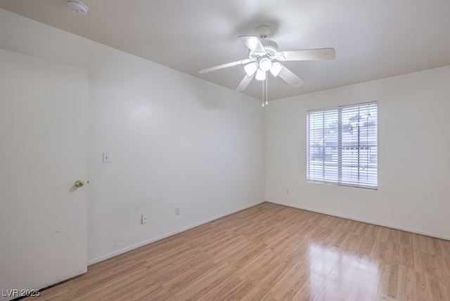 unfurnished room featuring ceiling fan and light hardwood / wood-style floors