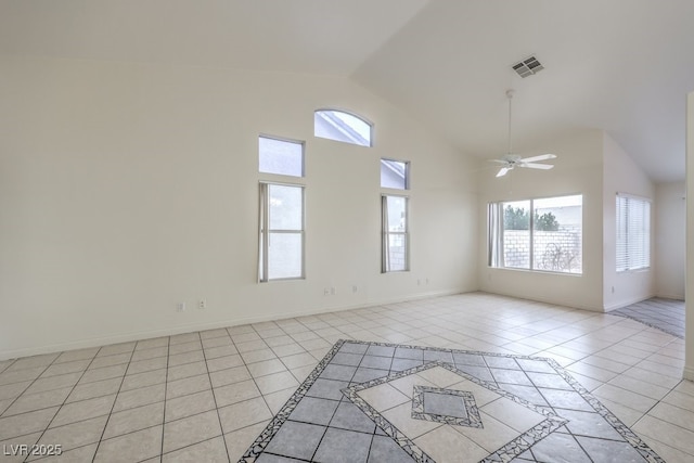 tiled empty room featuring high vaulted ceiling and ceiling fan