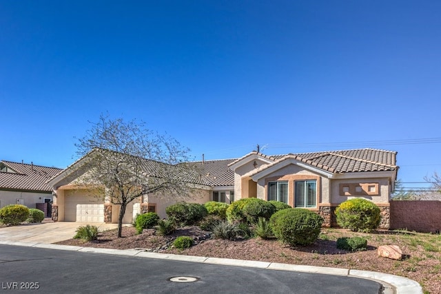 mediterranean / spanish house featuring a garage