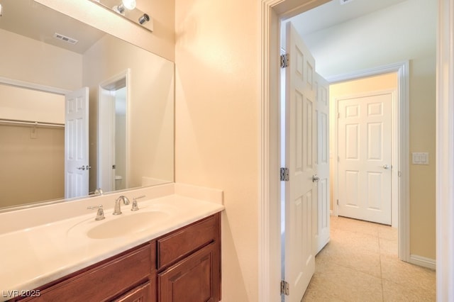 bathroom with tile patterned flooring and vanity