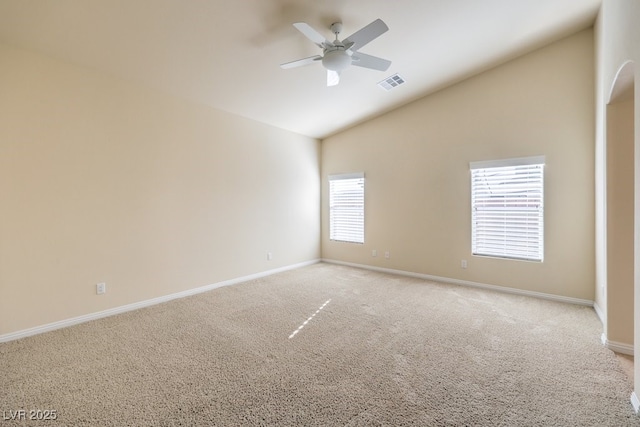 spare room featuring high vaulted ceiling, light colored carpet, and ceiling fan