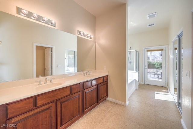 bathroom with vanity, tile patterned floors, and separate shower and tub