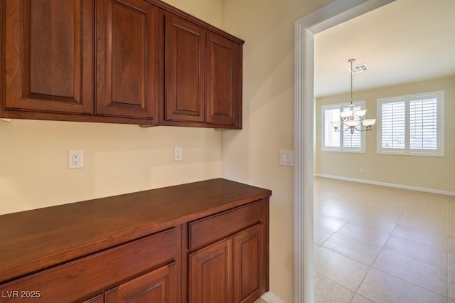 kitchen featuring a chandelier and hanging light fixtures