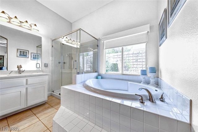 bathroom featuring vanity, independent shower and bath, and tile patterned flooring