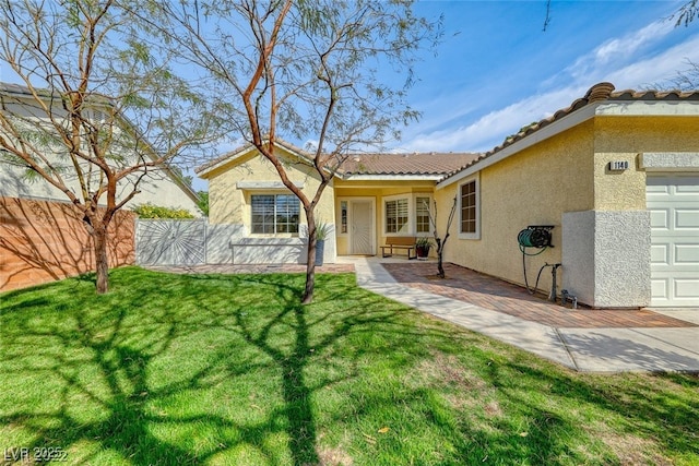 ranch-style house featuring a garage, a patio area, and a front yard