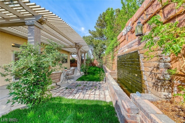 view of yard featuring a pergola and a patio area