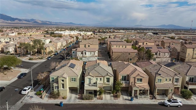 birds eye view of property with a mountain view