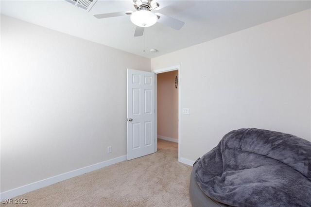 sitting room with light colored carpet and ceiling fan