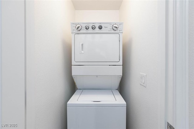 washroom with stacked washer and clothes dryer