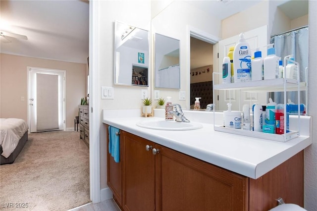 bathroom featuring ceiling fan and vanity