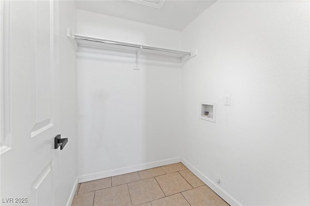 laundry area featuring gas dryer hookup, washer hookup, and light tile patterned floors