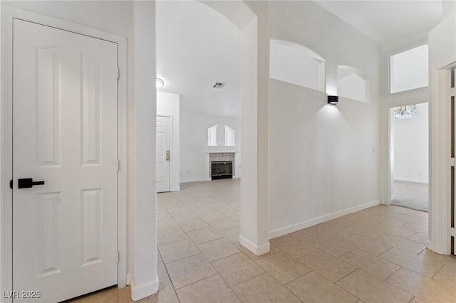 hallway featuring light tile patterned flooring