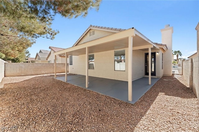 rear view of house with a patio