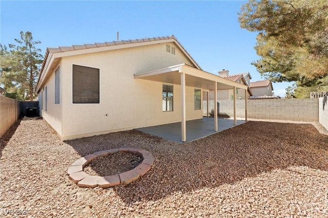 back of house featuring a patio and central AC unit