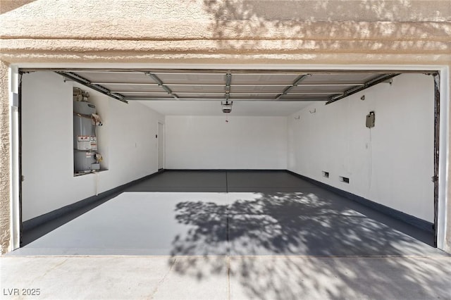 garage with a garage door opener and water heater