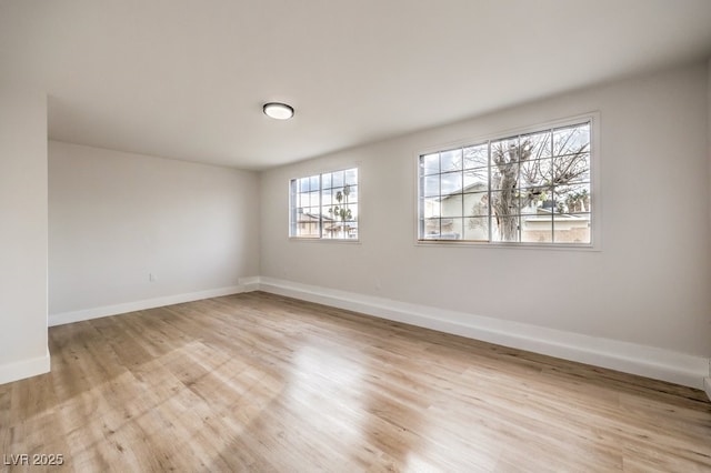 unfurnished room featuring light hardwood / wood-style floors