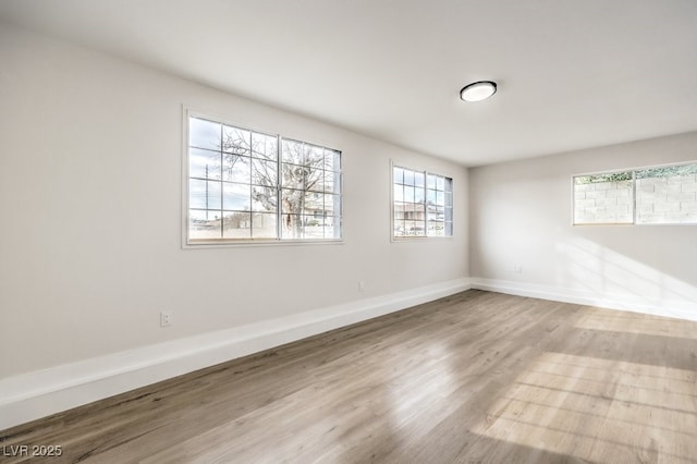 unfurnished room with light hardwood / wood-style flooring