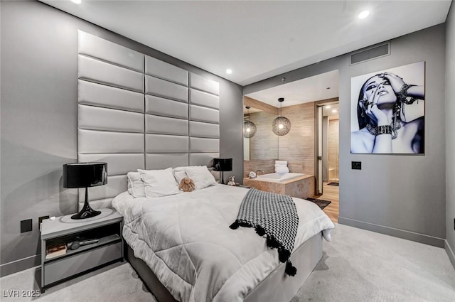 carpeted bedroom featuring connected bathroom