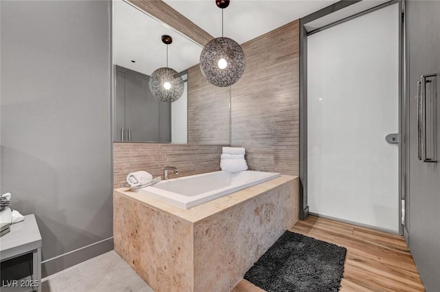 bathroom with hardwood / wood-style flooring