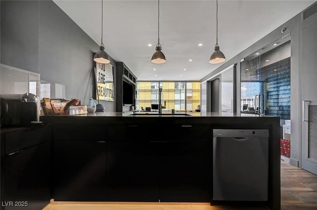 kitchen featuring pendant lighting, wood-type flooring, and dishwashing machine