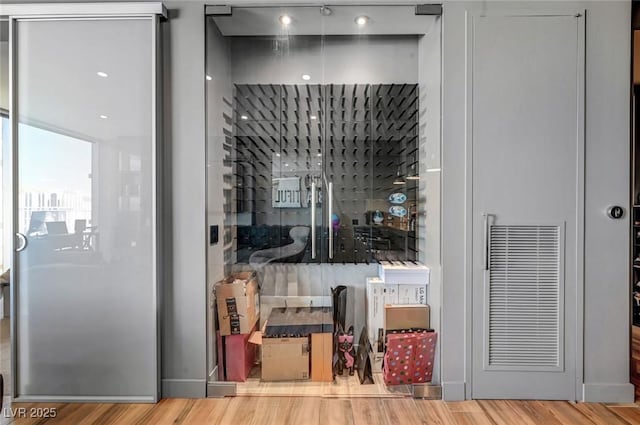 wine cellar with hardwood / wood-style flooring