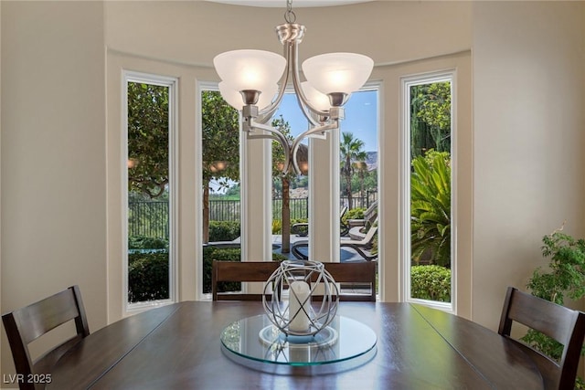 dining space with a notable chandelier