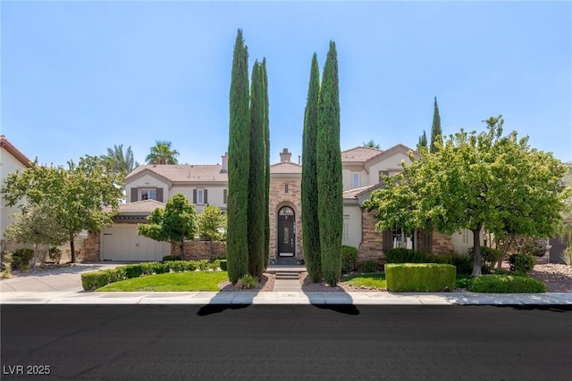 view of front of property featuring a garage