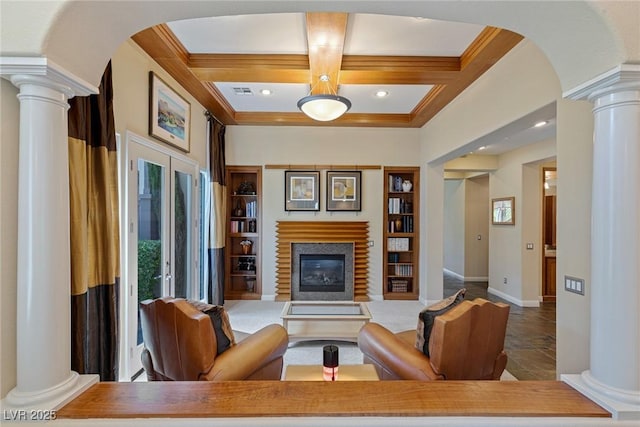 living room with decorative columns, crown molding, and coffered ceiling