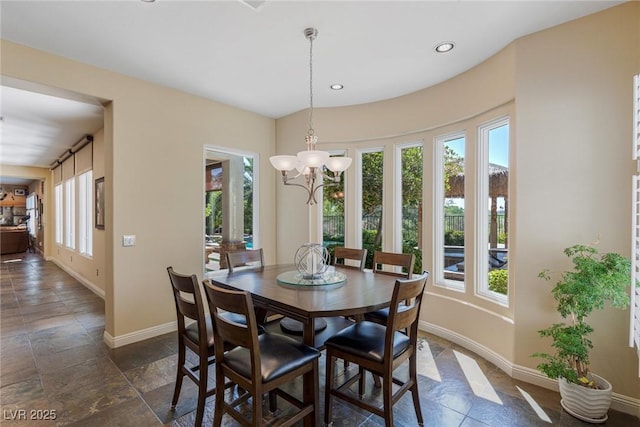 dining room with a notable chandelier and a wealth of natural light