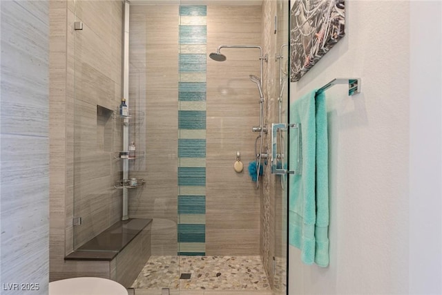 bathroom with a tile shower