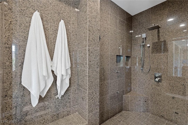 bathroom featuring a tile shower