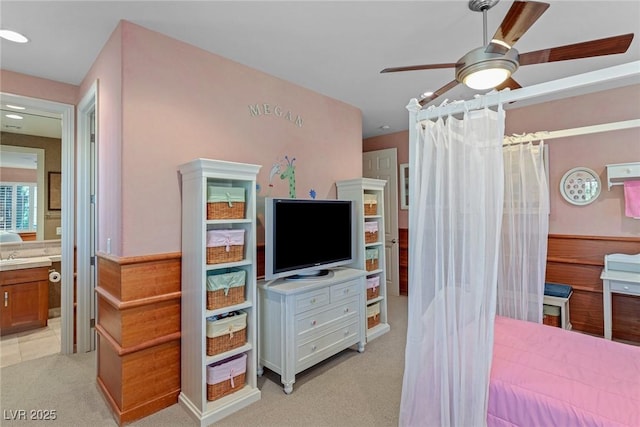 carpeted bedroom featuring ensuite bathroom